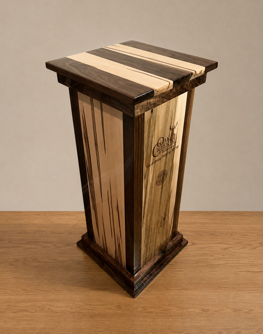 Flush hardwood mounting top on a square walnut and ambrosia maple taxidermy pedestal